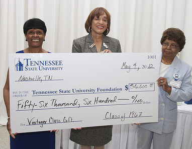 Agents present check for $56,000