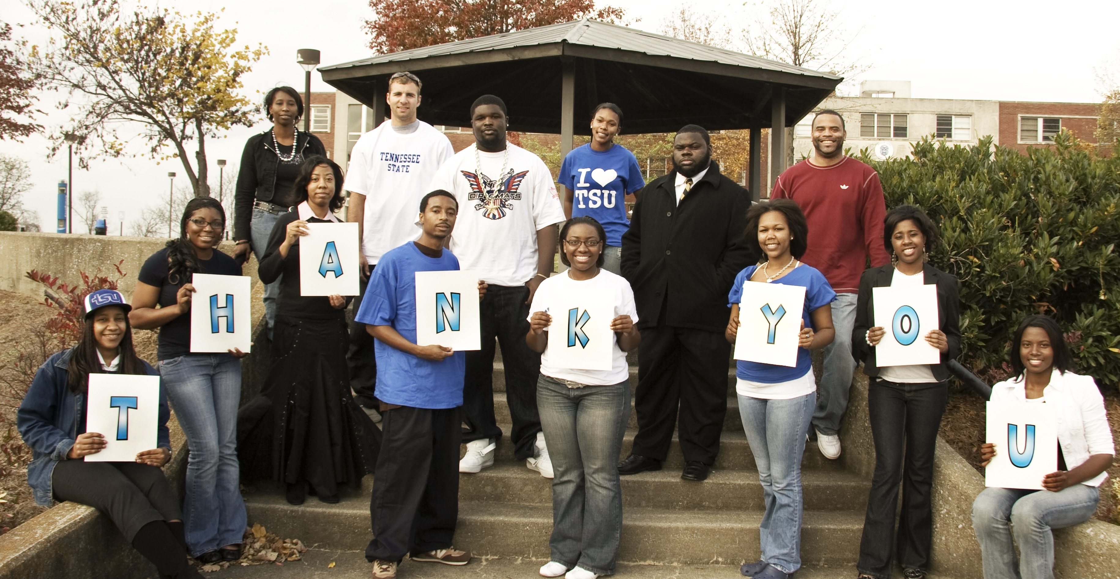 Photo of students holding thank you sign