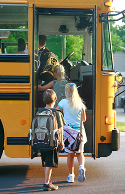 Kids getting on bus