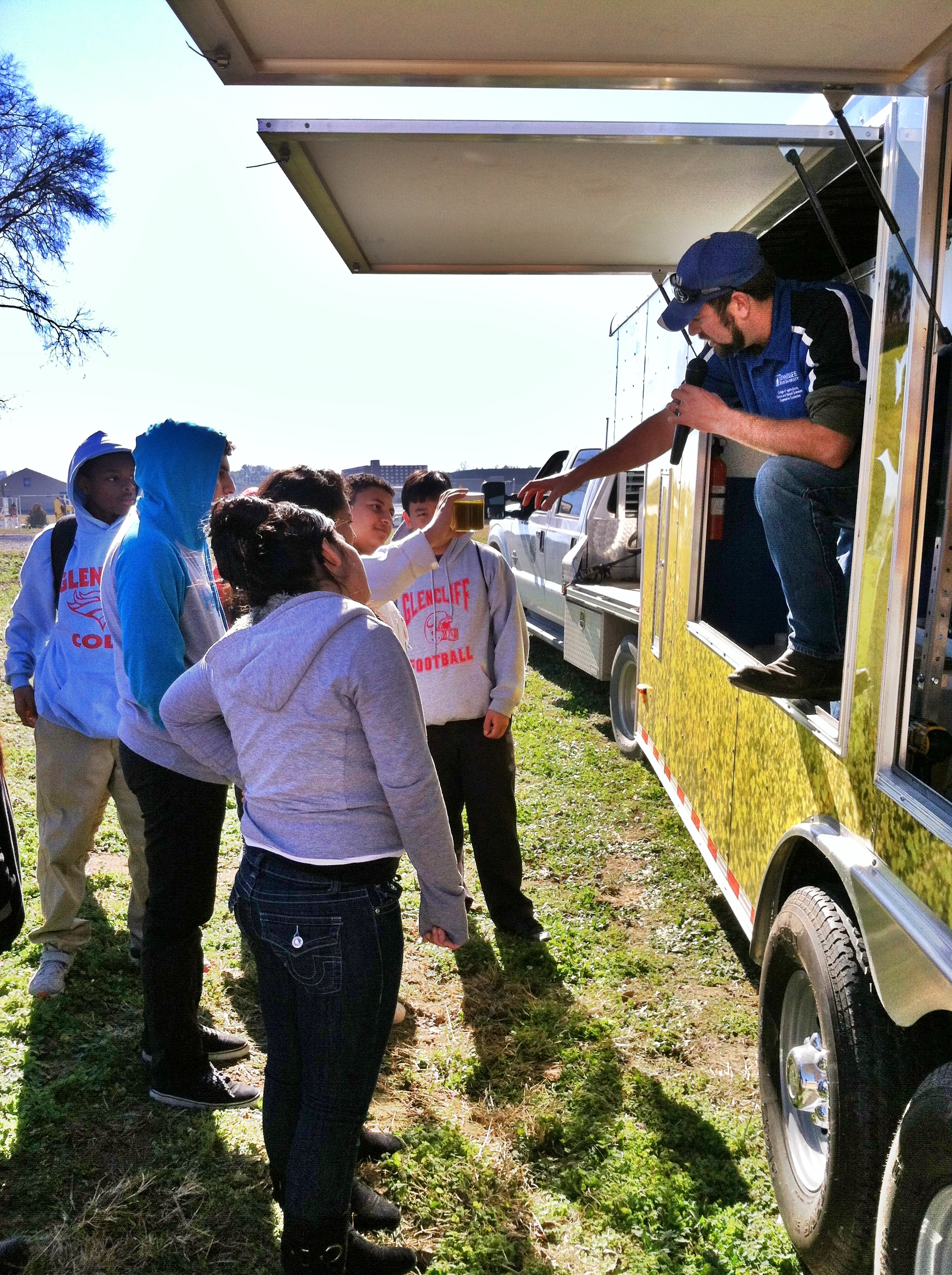 Chris Robbins demonstrating biodiesel production to Glencliff High school students