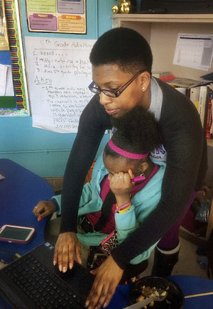 Whitley Bradley working with a young student