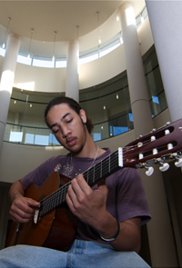 student playing guitar