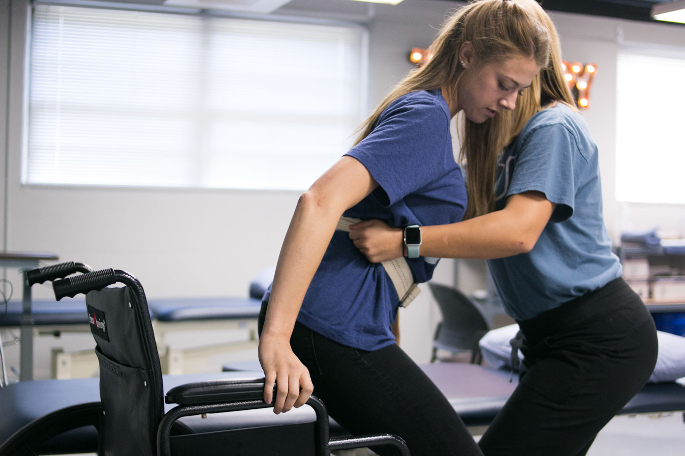 Lowering a patient into a wheelchair